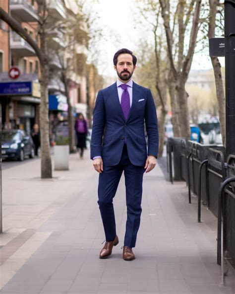 navy suit with purple tie.